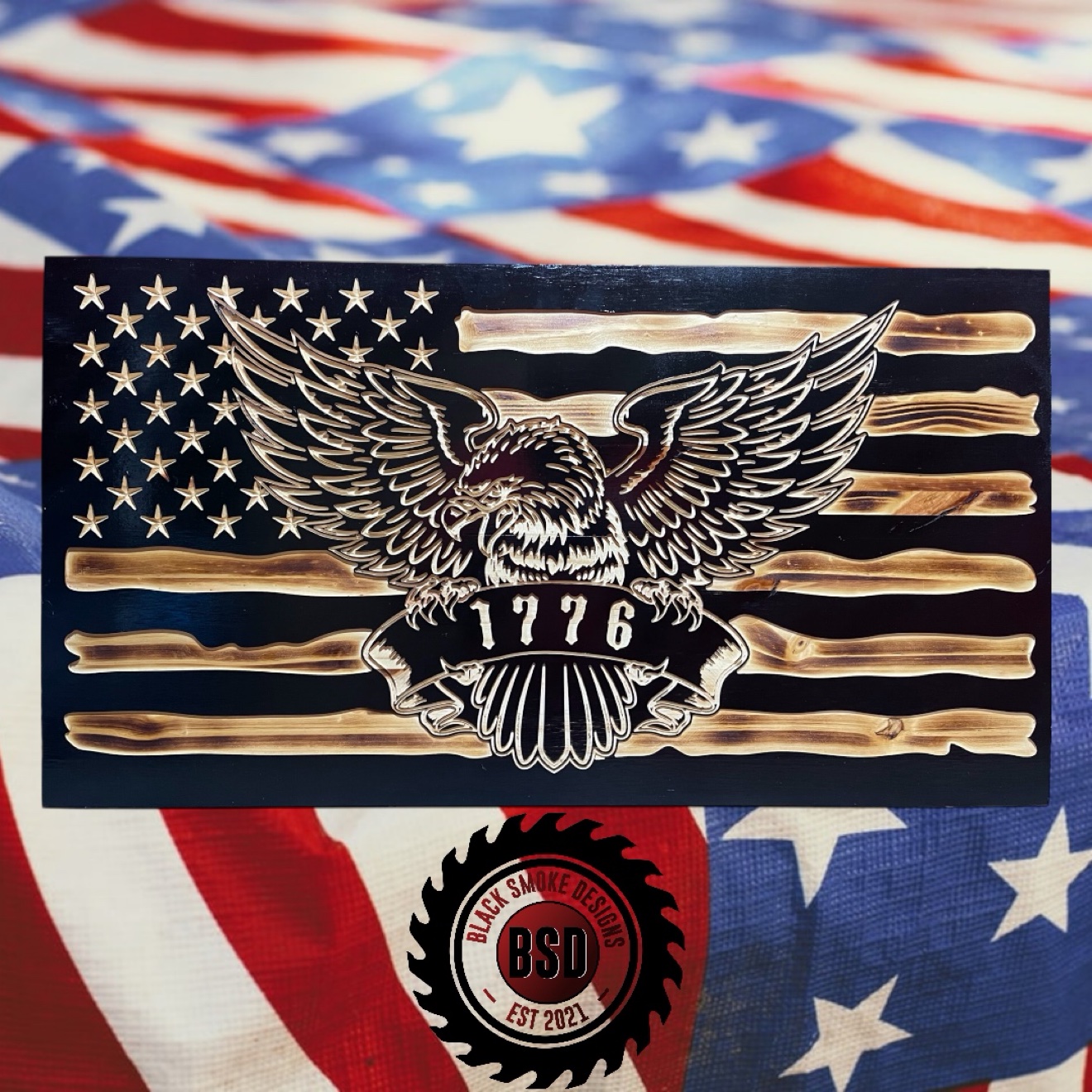 Wood flag with a carved bald eagle shield and 1776 banner
